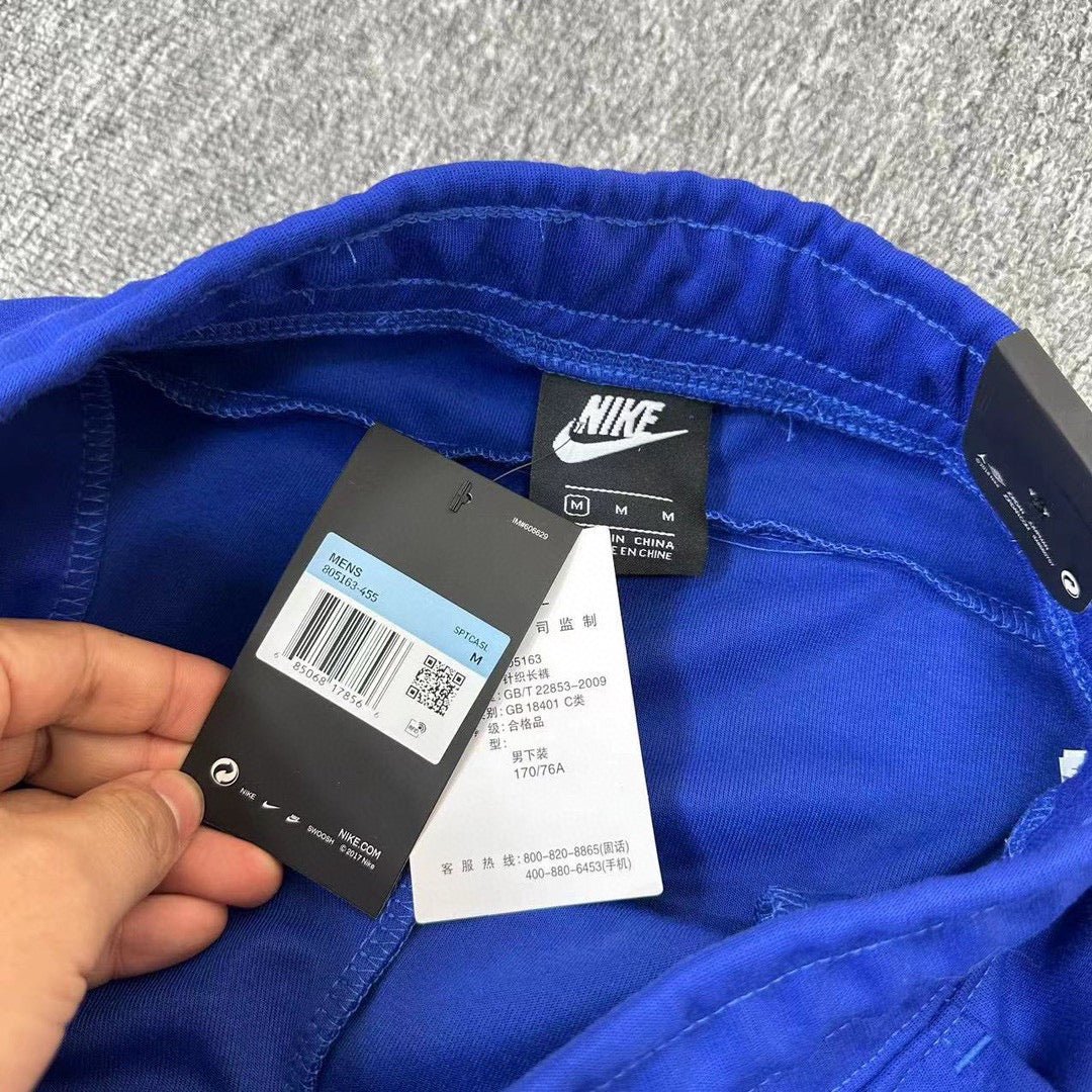 Elevate Your Style with NIKE Blue Tech Fleece Pants