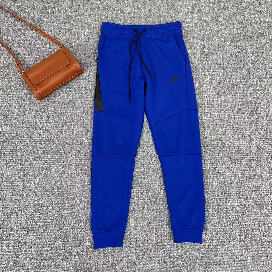 Elevate Your Style with NIKE Blue Tech Fleece Pants